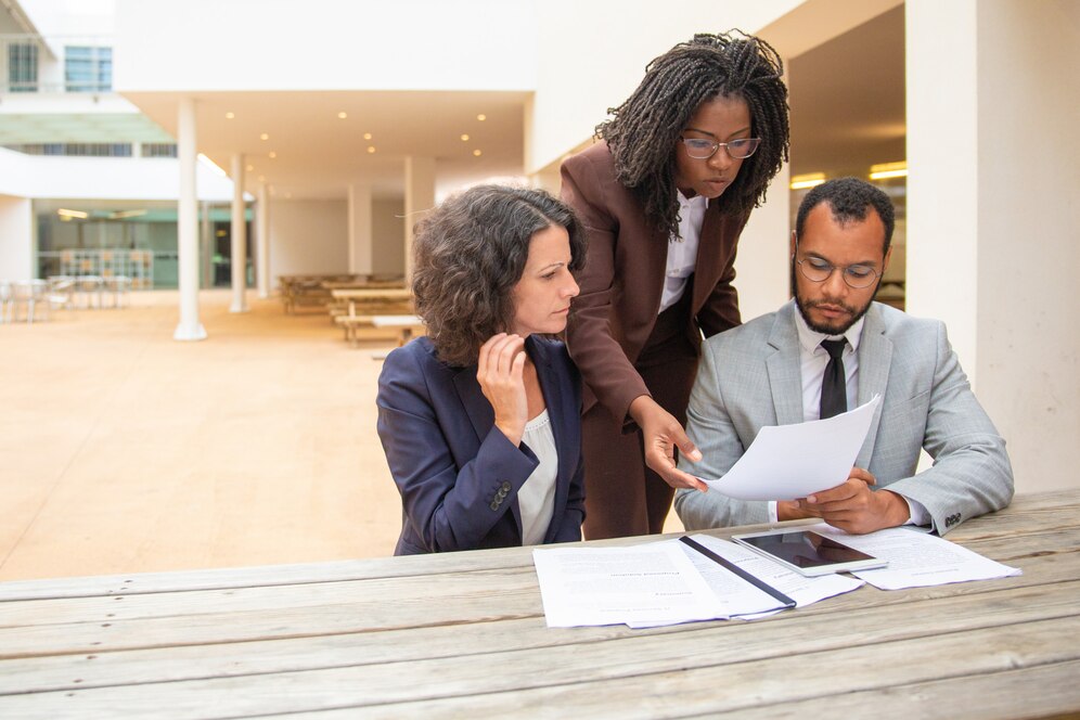 business-team-three-studying-documents_74855-1495